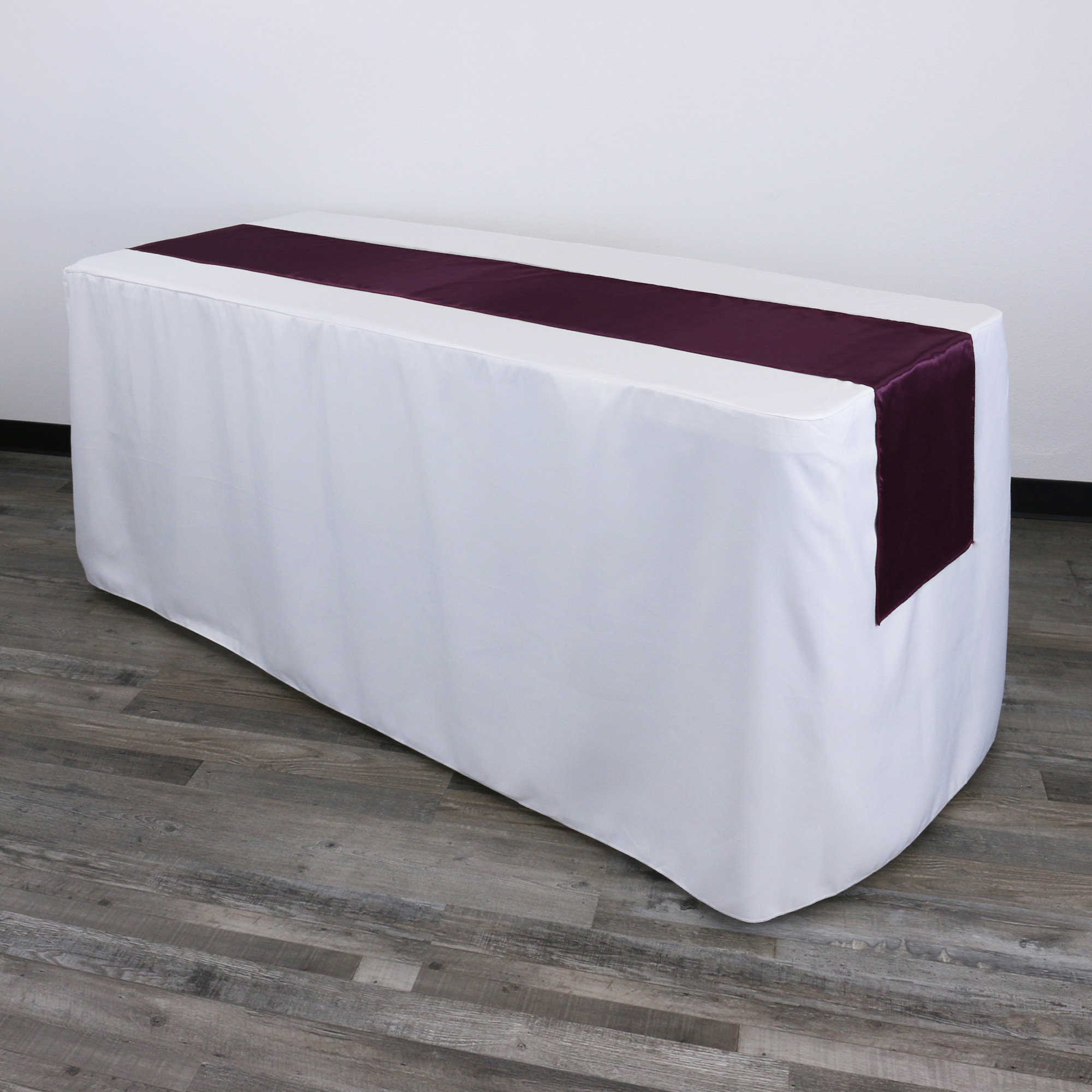 14 x 108 inch Satin Table Runners Eggplant on a rectangular table