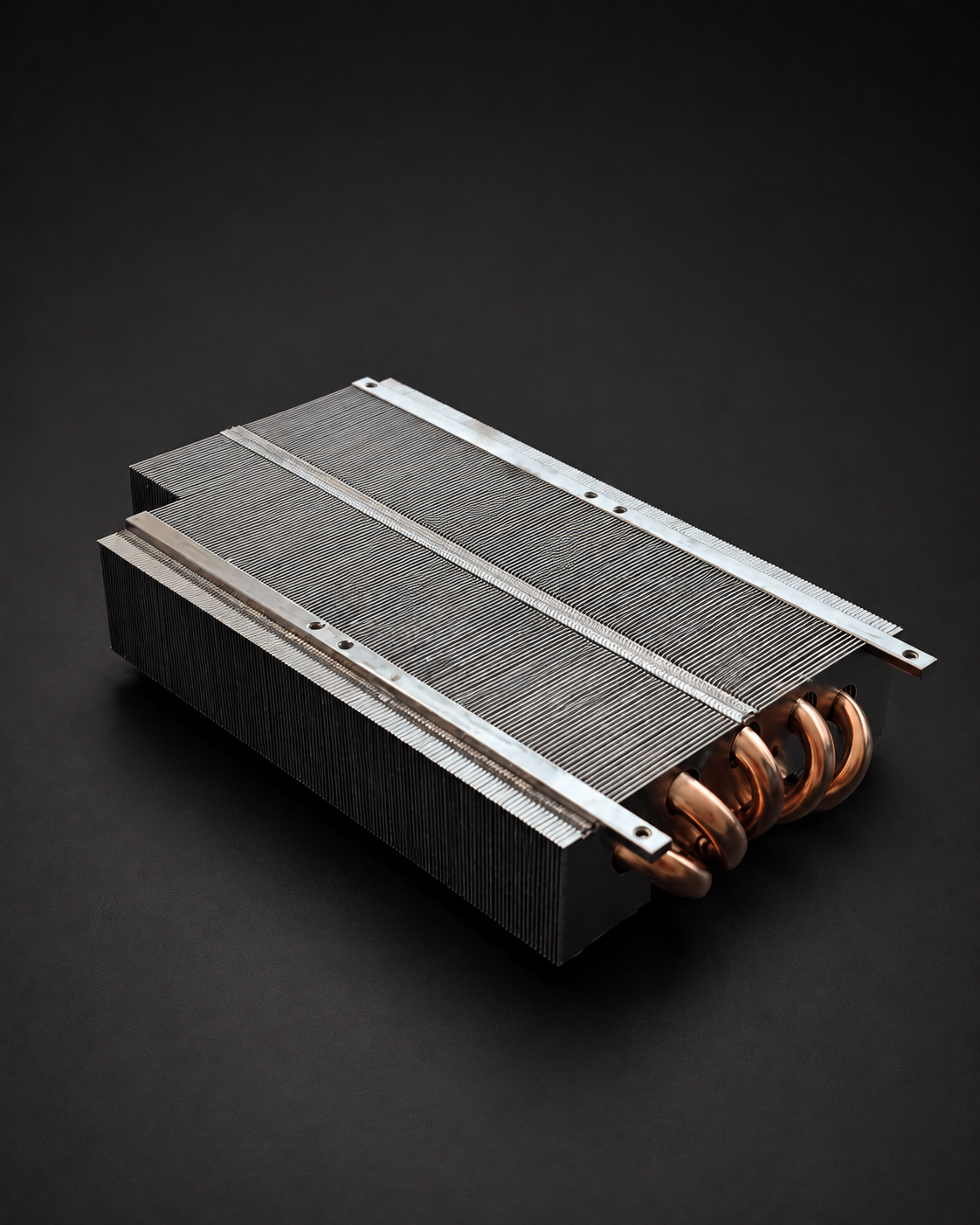 Cooler assembly showing copper heatpipes, metal fins, and mounting rails.