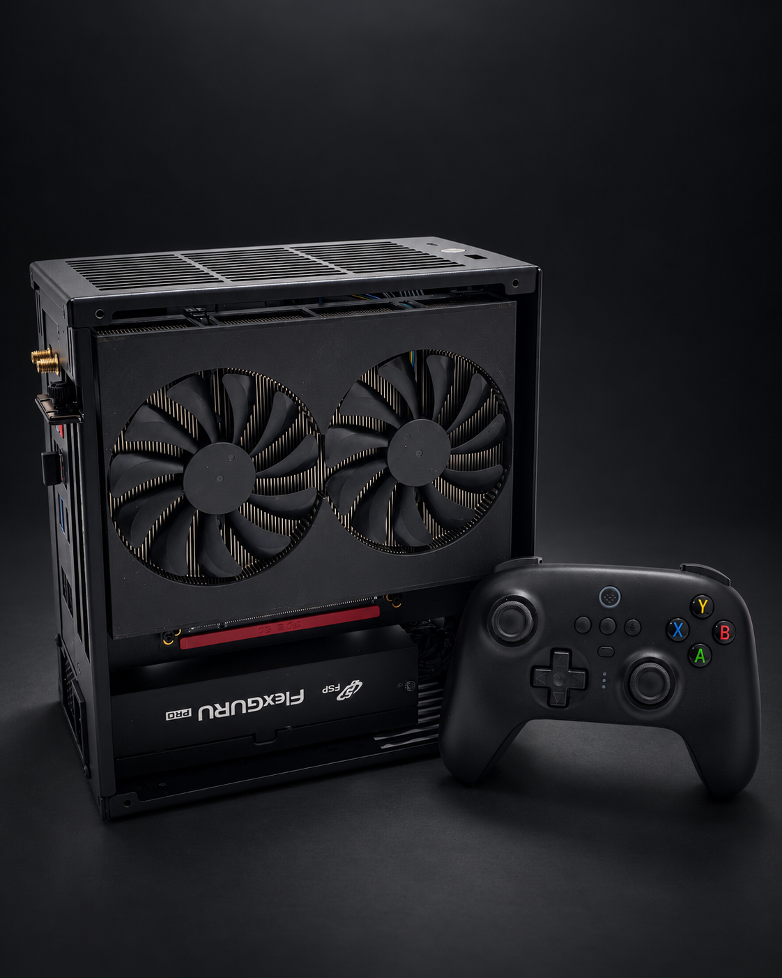 GRAVE compact PC prototype showing the dual-fan graphics-side assembly beside a black controller.