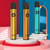 POSH Posh Plus 1500 Disposable vaporizer, three colorful sleek vape pens in yellow, orange, and teal, standing on a circular white platform with a vibrant pink and blue background.