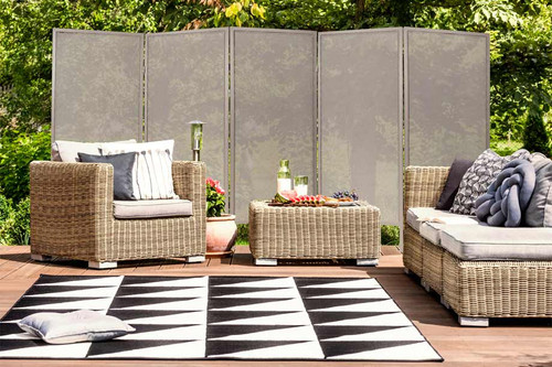 Folding Outdoor Privacy Screen used on an outdoor patio.
