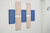 Decorative acoustic wall panels in blue and beige arranged in a geometric pattern.