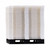Stacked white modular flooring panels on a pallet.