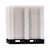 Stacked white modular flooring panels on a pallet.