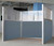 The Pre-Configured U-Shape Cubicle with Steel Blue fabric in an office.