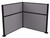 The 6' x 4' Pre-Configured Hush Panel Cubicle (L Shape) with cloud gray fabric and black trim.