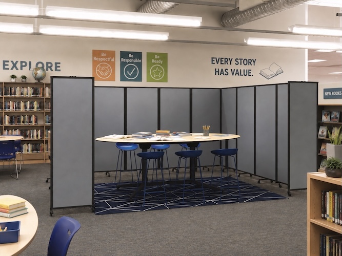 Library with folding display panels showing shelves, conference tables and chairs