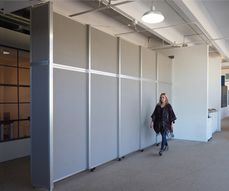 The wall-mounted Operable Wall Sliding Room Divider offers coverage up to 12’3" in height and 15’7” in width.