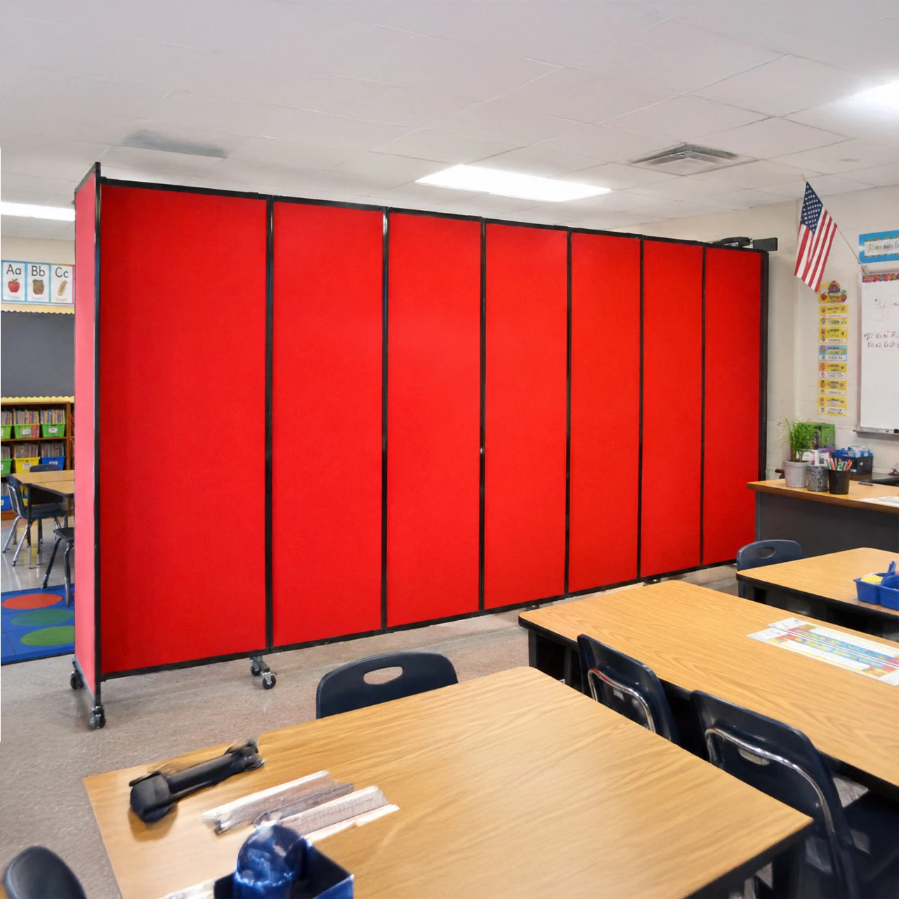 Library with folding display panels showing shelves, conference tables and chairs
