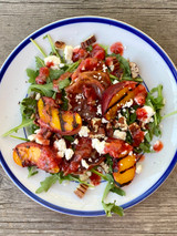 Grilled peach salad with crumbled cheese, toasted pecans & raspberry vinaigrette Grilled peach salad with crumbled cheese, toasted pecans & raspberry vinaigrette