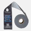 Custom packaging tape—unrolled section showing “Your Name Here” full-bleed design on reinforced kraft; gray background.