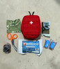 red first aid kit with supplies