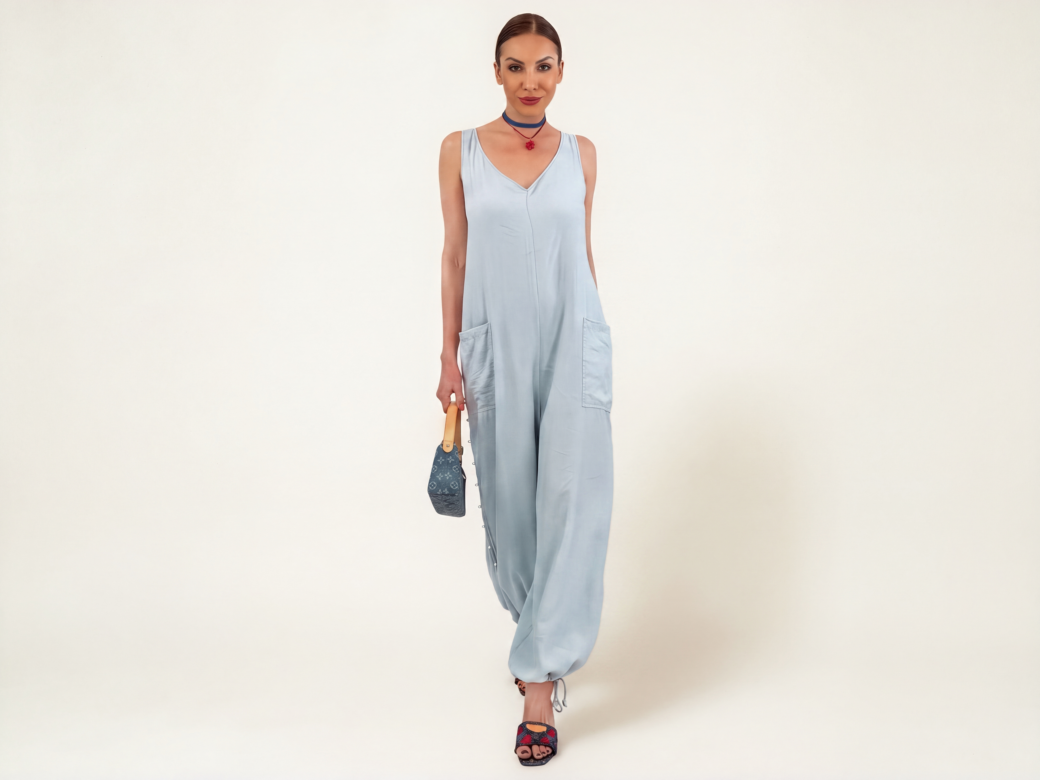 Back view of the ELUVARE Sky Blue jumpsuit showing the adjustable open-back detail