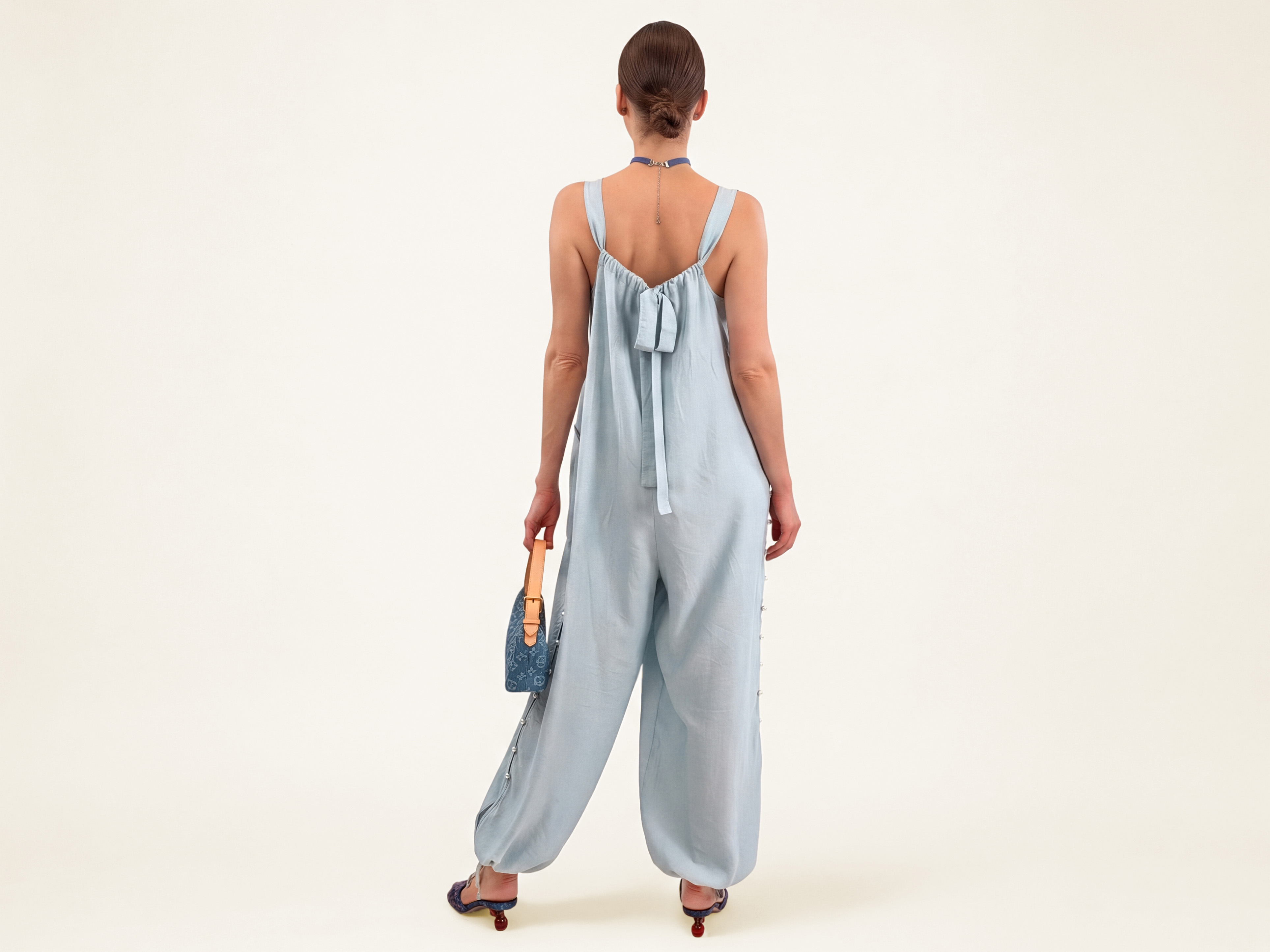 ELUVARE Sky Blue jumpsuit with a fluid silhouette and adjustable design details
