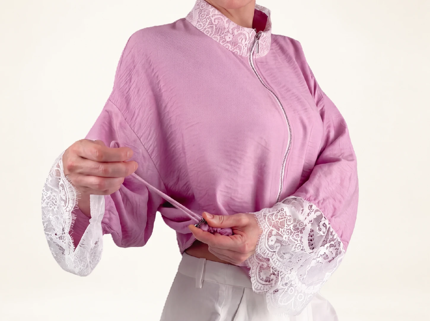 ELUVARE pink lace bomber jacket, shown from the back with a relaxed feminine silhouette