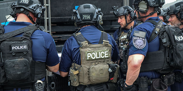 Police officers in full kit, preparing for training