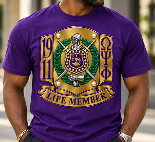 LIFE MEMBER Crest Collection

Celebrate a lifetime of brotherhood, commitment, and legacy with our LIFE MEMBER Crest Collection. Designed to make a distinguished statement, this premium piece transforms the traditional Omega Psi Phi Life Member crest into a bold, elevated work of wearable art.

The design features a richly detailed 1911 crest, complete with the knight’s helmet, crossed swords, laurel wreath, shield, pearls, lamp, and armored gauntlet. Deep royal purple, old gold, emerald green, and polished silver tones give the artwork a dimensional, luxury finish, while the commanding LIFE MEMBER banner proudly completes the design.

Created for the Life Member who understands that membership is more than a moment—it represents years of service, brotherhood, achievement, and an enduring commitment to Omega Psi Phi Fraternity, Inc.

Available on select short-sleeve tees, long-sleeve tees, and premium crewneck sweatshirts in Purple, Old Gold, Pewter Green, and Cream.

Details: Premium full-color crest artwork • Rich dimensional detailing • Bold Life Member presentation • Designed for an elevated, distinguished look • Ideal for chapter events, homecoming, reunions, conferences, or everyday wear

LIFE MEMBER — Brotherhood for a lifetime. Legacy for generations.