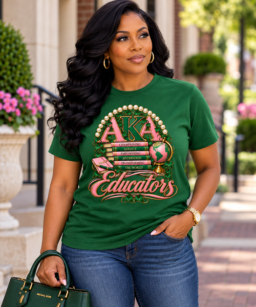AKA Educators — Championing, Serving, Empowering

Celebrate the women who do more than teach—they inspire, empower, serve, and transform the world.

Our AKA Educators design is a sophisticated tribute to the lasting impact of Alpha Kappa Alpha women in education. Rich layers of signature pink and green come together in an elevated collegiate-inspired composition featuring books, ivy, a globe, and classic AKA details, beautifully framed by the message:

CHAMPIONING • SERVICE • EMPOWERING • SISTERHOOD • TRANSFORMING THE WORLD

Finished with an elegant “Educators” script, this statement piece honors educators who lead with knowledge, purpose, sisterhood, and service. The intricate artwork gives the design a polished, high-end look while remaining unmistakably AKA.

Perfect for teachers, professors, administrators, counselors, educational leaders, retired educators, and AKA women working throughout the field of education.

Pair it with denim and a crisp white Oxford for an effortlessly polished look, or style it with slacks, a skirt, or your favorite AKA accessories.

AKA Educators — because educating is more than a profession. It’s a legacy of service, leadership, and transformation.