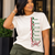 There’s PRETTY—and then there’s The PRETTY Standard™.

Created as a celebration of confidence, character, achievement, and excellence, this statement design gives new meaning to every letter:

P — Poised
R — Resilient
E — Educated
T — Tenacious
T — Timeless
Y — Yielding to Excellence

Finished with the flowing Girl signature, the asymmetrical vertical design creates a sophisticated look that feels just as natural styled with sneakers as it does layered over a crisp white Oxford with denim, heels, and your favorite accessories.

PRETTY was never just about appearance. It’s a standard.