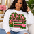 AKA Educator — Teach. Inspire. Empower. Uplift.

Celebrate the women who don’t just teach lessons—they shape futures. The AKA Educator design honors the educators of Alpha Kappa Alpha Sorority, Incorporated® who carry excellence, service, and sisterhood into classrooms and communities every day.

Rich shades of pink and green come together with classic academic details, including stacked books, an apple, writing instruments, elegant ivy, and pearl accents. The bold AKA Educator centerpiece is finished with four words that capture the heart of an educator’s calling:

TEACH • INSPIRE • EMPOWER • UPLIFT

Designed with the elevated, statement-making style of Twin Light Clothing Company, this piece is perfect for teachers, professors, administrators, counselors, educational leaders, and AKA women who have dedicated themselves to educating and uplifting the next generation.

Wear it for AKA events, school spirit days, educator conferences, chapter gatherings, Founders’ Day celebrations, or simply as a proud reflection of your profession and sisterhood.

Made to order with care. Please allow 5–7 business days for processing.