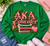AKA Educator — Teach. Inspire. Empower. Uplift.

Celebrate the women who don’t just teach lessons—they shape futures. The AKA Educator design honors the educators of Alpha Kappa Alpha Sorority, Incorporated® who carry excellence, service, and sisterhood into classrooms and communities every day.

Rich shades of pink and green come together with classic academic details, including stacked books, an apple, writing instruments, elegant ivy, and pearl accents. The bold AKA Educator centerpiece is finished with four words that capture the heart of an educator’s calling:

TEACH • INSPIRE • EMPOWER • UPLIFT

Designed with the elevated, statement-making style of Twin Light Clothing Company, this piece is perfect for teachers, professors, administrators, counselors, educational leaders, and AKA women who have dedicated themselves to educating and uplifting the next generation.

Wear it for AKA events, school spirit days, educator conferences, chapter gatherings, Founders’ Day celebrations, or simply as a proud reflection of your profession and sisterhood.

Made to order with care. Please allow 5–7 business days for processing.