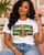 Celebrate the educators who lead with knowledge, purpose, and service. The AKA Educator design blends timeless collegiate styling with an elevated Alpha Kappa Alpha–inspired aesthetic, featuring bold EDUCATOR lettering, signature pink and green striping, rich gold detailing, and a distinguished crest centerpiece.

Designed for teachers, professors, administrators, counselors, and education professionals, this piece honors the women who shape minds, strengthen communities, and create lasting impact through education. The polished, almost embossed look gives the design a luxe finish while still keeping it versatile enough for classrooms, conferences, chapter events, educator celebrations, and everyday AKA style.

Available on select tees, long sleeves, and sweatshirts.

Made to order. Please allow 5–7 business days for processing before shipment.