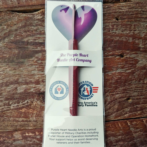 Purpleheart Crochet Hooks - Strong, Stylish, and Unique, in packaging with heart design on a wooden background, Purpleheart brand crochet hook.