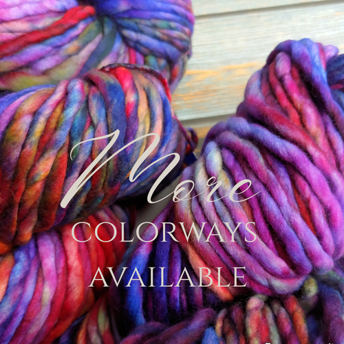 Malabrigo Rasta Super Bulky Merino Wool Yarn, hand-dyed luxury skein in vibrant multicolor hues of pink, purple, blue, and red tones.