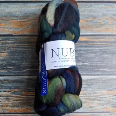 Malabrigo Nube Pocion, 4oz hand-dyed merino wool roving, dark blues, greens, and browns, ideal for spinning, felting, and fiber art with Malabrigo luxury artisan fiber supplies.