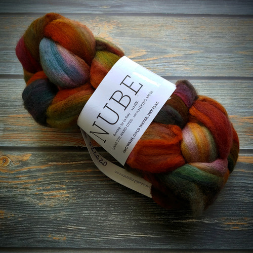Malabrigo Nube Diana 100% Merino Wool Roving, 4oz weight in multicolored shades of orange, green, blue, and brown, suitable for spinning and felting fiber crafts.