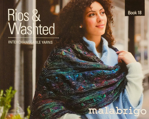 Malabrigo Rios & Washted knitting pattern book cover, woman wrapped in colorful multicolored shawl, softcover book with 14 intermediate designs.