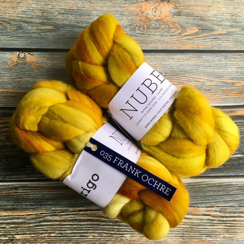 Malabrigo Nube Frank Ochre, 4oz Merino Wool Roving, spinning & felting fiber in yellow-orange hues, braided and labeled.