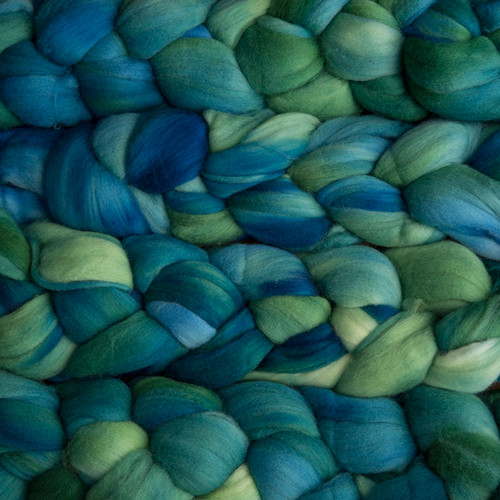 Malabrigo Nube Solis 100% Merino Wool Roving, 4oz, natural blue and green hues, ideal for spinning and felting fiber crafts, product of Malabrigo fiber arts.