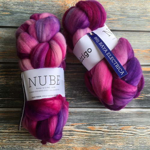 Malabrigo Nube Wool Roving Baya Electrica, hand-dyed 100% Merino fiber combed top, vibrant shades of pink, purple, and magenta, 4oz skeins spinning and felting supply.