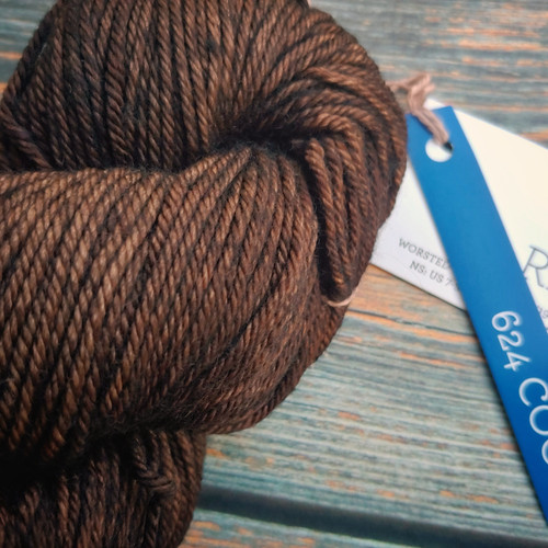 Malabrigo Rios Coco Tonal Espresso Superwash Merino Yarn skein, brown color, labeled with 624 Coco, showcasing soft, chunky, merino wool yarn.