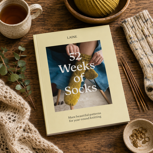 52 Weeks of Socks, Vol. II, knitting book with yarn and needles, featuring beautiful patterns for year-round knitting, by Laine.