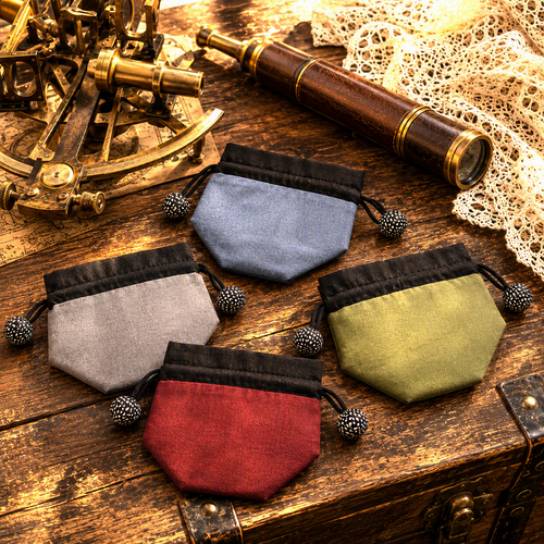 Lantern Moon Silk Stitch Marker Pouches in red, grey, blue, and green, with black trim and tassels on a wooden surface.