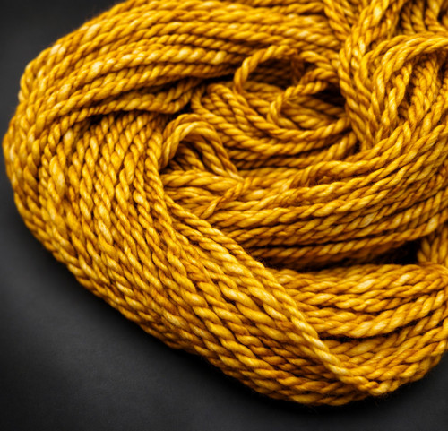 Happiness golden ochre bulky handspun merino wool yarn showing thick, 2-ply yarn.