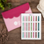 KnitPro Dreamz Deluxe Single Ended Wooden Crochet Hook Set, featuring colorful hooks in a pink case and display card on a wooden background.