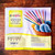 Knitter's Pride Dreamz DPN set packaging for 6 inch double pointed needles for sock knitting illustrating wooden and multicolored needles in a basket with blue yarn nearby.