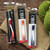 Swing Maxi Ergonomic Crochet Hooks in red, orange, and blue, packaged, with ergonomic curved grip, for comfortable crocheting.