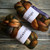 Malabrigo Nube Wool Roving in Mandragora, 4oz, hand dyed 100% Merino fiber, combed top skeins in earthy tones of brown, green, and orange.