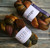 Malabrigo Nube Wool Roving in Mandragora, 4oz hand dyed 100% Merino fiber combed top skeins in earthy tones, for spinning and felting.