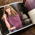 Malabrigo Book 13: Shawl Road, woman wearing purple and white striped shawl, showcasing drape and style on page spread.