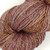 Handspun Luxury Merino Yarn, Fading Foliage, sport/DK weight, 100% superfine wool, skein with muted purple, orange, and beige multicolored hues.