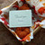 Handmade Art Yarn, Butterscotch Merino, DK Weight, orange yarn in a box with floral paper, Artisan Luxury Yarn, small business product.