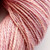 Pink Opal Luxury Handspun Merino yarn, 2-Ply Sport/DK wool from brand 56, showcasing soft pastel pink hues in a twisted skein.