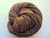 Luxury Handspun Merino yarn, November Autumn color, Artisan 2-Ply Sport/DK wool skein with multicolored orange, purple, and green hues.