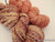 Hand-spun 2‑ply Sport/DK Merino yarn in Peach Rose.
