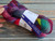 Malabrigo Nube Boreal, 4oz 100% Merino Wool Roving skein in vibrant purple, pink, green, and blue hues, labeled "884 Boreal".